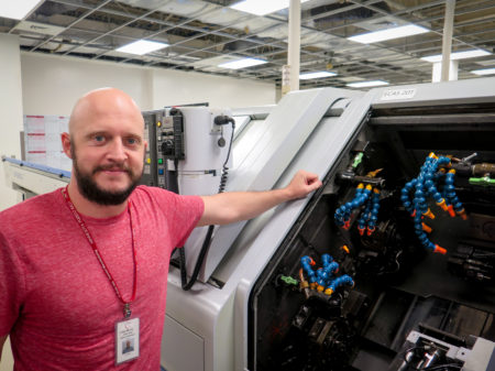 Jared Haley, general manager of the C-Axis plant in Caguas, Puerto Rico, says computer-operated milling machines, like this one can cost more than a half million dollars. Heat and humidity in the plant after Hurricane Maria left many of the machines inoperable, Haley says.