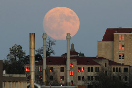 The moon rises beyond the University of Kansas campus in Lawrence, Kan., Nov. 13, 2016. The 2017 supermoon will appear Dec. 3.