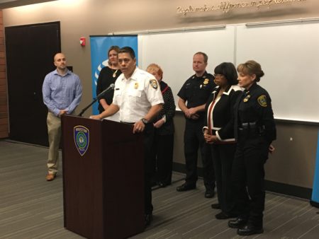 Houston Fire Department Chief Samuel Peña is flanked by HPD officers and others announcing a new safe driving campaign to raise awareness during the holidays about texting while driving.