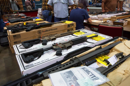 Sales surged for guns, such as these seen at a show in Kenner, La., in late 2012, after the mass shooting in Newtown, Conn.