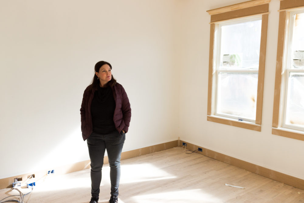 Jocelyn Guite surveys the inside of her new home.