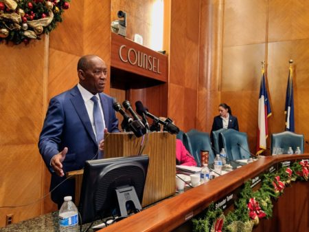 Mayor Sylvester Turner speaks to reporters after a city council meeting on December 19, 2017.