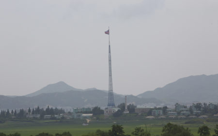 A giant North Korean flag flutters from a 528-foot pole near the border with South Korea. Tunnels built by North Korea's military are believed to extend across the border.