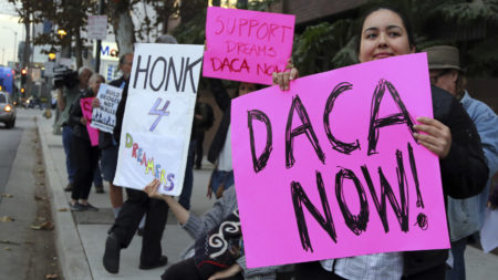 File photo of January 10, 2018, demonstrators urging the Democratic Party to protect the Deferred Action for Childhood Arrivals Act (DACA) rally outside the office of California Democratic Sen. Dianne Feinstein in Los Angeles.