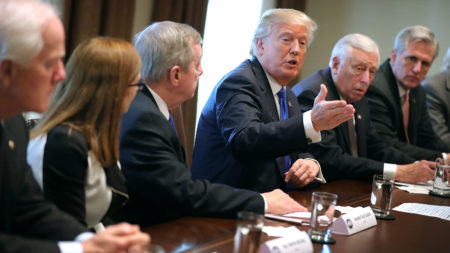 President Trump presides over a meeting about immigration with Republican and Democratic members of Congress at the White House on Tuesday. Congress and the White House are trying to work out an immigration deal prior to Jan. 19.