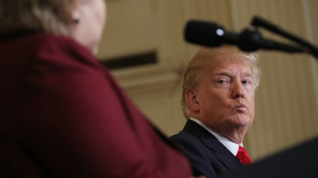 President Trump listens as Norwegian Prime Minister Erna Solberg speaks at a joint news conference Wednesday. At an Oval Office meeting on immigration policy, Trump said the U.S. should want more people from countries like Norway, disparaging Haiti and what he called "shithole countries" in Africa.