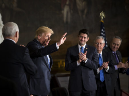 President Trump joins congressional leaders on Wednesday during a Congressional Gold Medal ceremony for former Senate Majority Leader Bob Dole at the U.S. Capitol. On Thursday, Trump scrambled efforts to negotiate a spending deal with a morning tweet.