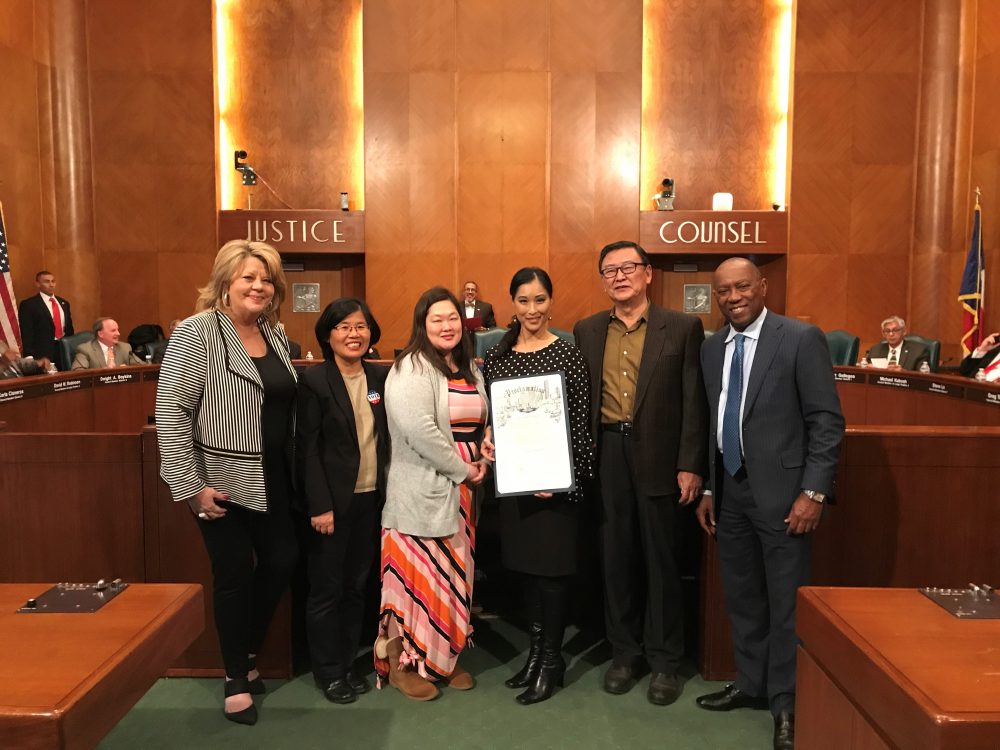 Joy Alessi (center) is co-director of the Adoptee Rights Campaign. In this photo she poses holding a proclamation passed by the Houston City Council in support of the campaign on January 23rd 2018.