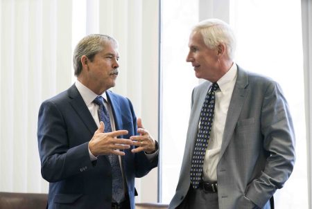 State Sen. Larry Taylor, R-Friendswood, l, chats at the lunch break with chairman Justice Scott Brister at the Texas Commission on School Finance meeting on Jan. 23, 2018.