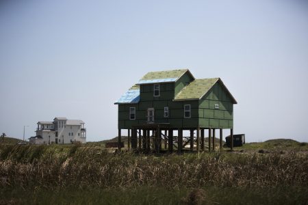 A house in Port Aransas gets a new roof and siding on Sept. 30, about a month after Hurricane Harvey hit.