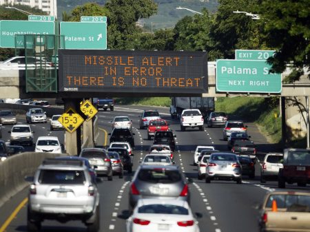 The FCC said Tuesday that the false alert of a ballistic missile sent in Hawaii on Jan. 13 occurred when the worker in charge of alerts confused a drill for a real missile emergency. A highway sign in Honolulu corrects the error.