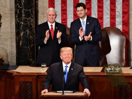 President Trump listens to applause before delivering his State of the Union address Tuesday night at the Capitol in Washingto