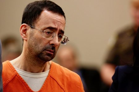 In this Nov. 22, 2017, file photo, Dr. Larry Nassar appears in court for a plea hearing in Lansing, Mich.