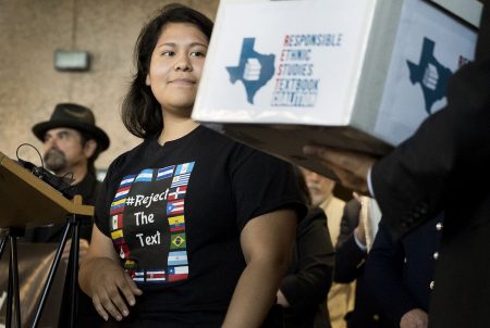 Carolina Hernandez, a student in the Houston ISD, spoke during a news conference at the Texas Education Agency on Nov. 15, 2016, about a proposed Mexican-American studies textbook that educators and activists have criticized. As Hernandez spoke, she glanced at a box holding 15,000 petitions against the textbook.