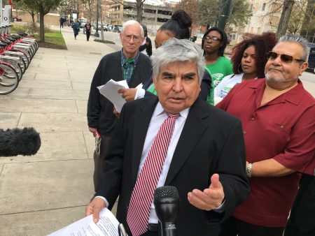 Activist Johnny Mata and members of the Greater Houston Coalition for Justice call for en end to Harris County's opposition to bail bond reform.