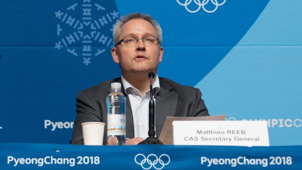 Matthieu Reeb, secretary-general of the Court of Arbitration for Sport, announces the court's decision on Feb. 1 regarding Russian athletes. He is set to announce another decision Friday.