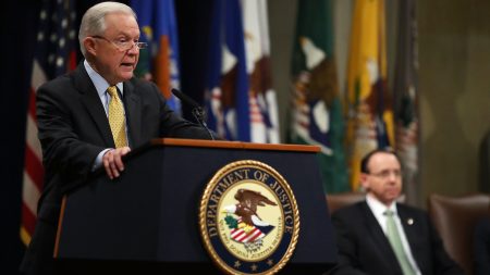 Attorney General Jeff Sessions (left) speaks while Deputy Attorney General Rod Rosenstein listens during a summit at the Justice Department on Feb. 2 in Washington, D.C., to discuss efforts to combat human trafficking.