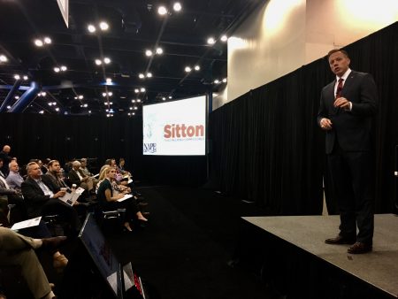 Ryan Sitton speaks at NAPE, an energy industry gathering in Houston, on February 9, 2018
