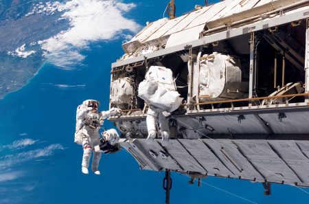 FILE - In this Dec. 12, 2006, file photo, made available by NASA, astronaut Robert L. Curbeam Jr., left, and European Space Agency astronaut Christer Fuglesang, participate in a space walk during construction of the International Space Station.