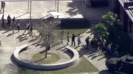 In this frame grab from video provided by WPLG-TV, students from Marjory Stoneman Douglas High School in Parkland, Fla., are led away from the school following a shooting  on February 14th, 2018.
