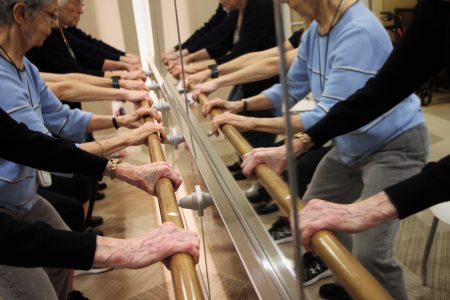 Residents at Avanti Senior Living attend a barre exercise class, in Cypress.