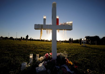 Candle drippings hang off one of 17 crosses at a memorial for the victims of the shooting at Marjory Stoneman Douglas High School in Parkland, Florida, U.S. February 16, 2018.