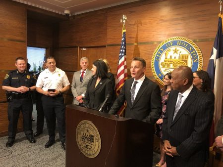 George T. Buenik, behind the lecturn, is named director of the Office of Public Safety and Homeland Security by Houston Mayor Sylvester Turner, right.