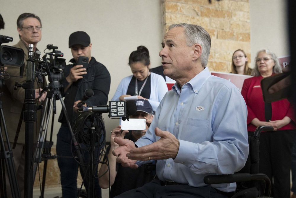 Gov. Greg Abbott talks to the press after casting his vote in Austin on Tuesday, Feb. 20, 2018, the first day of early voting in Texas for the March primary elections.