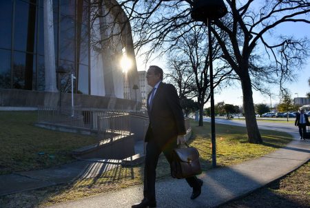 State Sen. Carlos Uresti, D-San Antonio, walks into the federal courthouse in San Antonio on Monday morning, Feb. 12, 2018, as his trial continues.