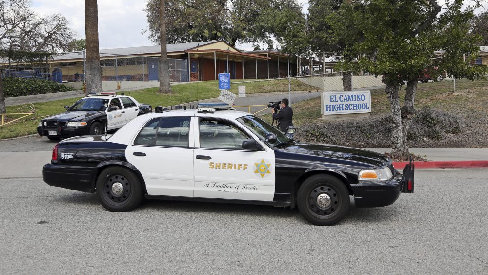 LA County Sheriff's patrol cars leave El Camino High School in Whittier, Calif., on Wednesday. A 17-year-old student threatened to open fire at the school days after the massacre at a Florida school. An alert security guard who overheard him reported it to police, who went to the boy’s home and found two AR-15 rifles, authorities said Wednesday