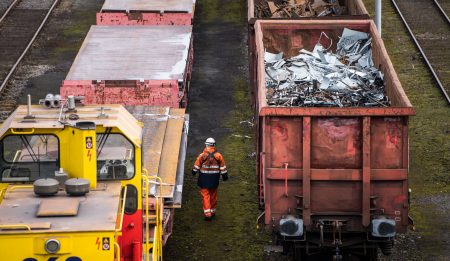 Trains with scrap metal stay in front of the Huettenwerk Krupp Mannesmann GmbH steel mill in Duisburg, Germany. President Trump is expected to order tariffs on aluminum and steel imports as early as Thursday.
