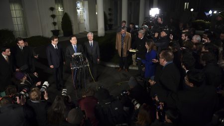 South Korean national security adviser Chung Eui-yong speaks to reporters at the White House Thursday evening. South Korean intelligence chief Suh Hoon is at left.