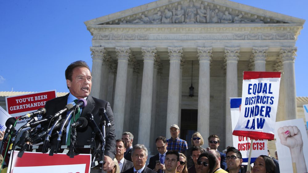 Former California Gov. Arnold Schwarzenegger speaks at a rally outside the U.S. Supreme Court in October on the day arguments took place in a case about political maps in Wisconsin.
