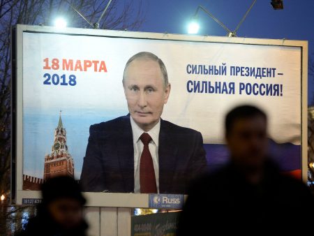 A billboard in Saint Petersburg shows an image of Russia's President Vladimir Putin in January 2018. The sign says, "Strong president - Strong Russia."