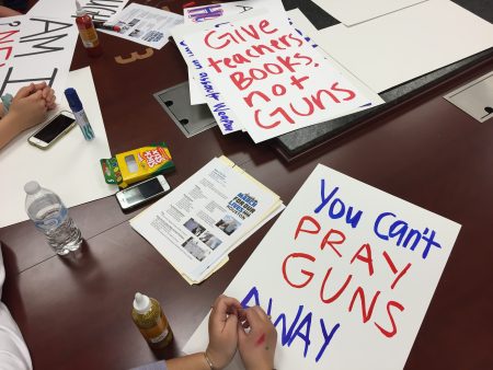 More than a dozen students gathered this week to make signs for the local March for Our Lives rally, which could draw upwards of 10,000 students.