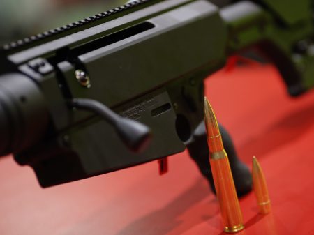 Ammunition and a Remington Bushmaster rifle are seen at a gun display during a National Rifle Association outdoor sports trade show in 2017 in Harrisburg, Pennsylvania.