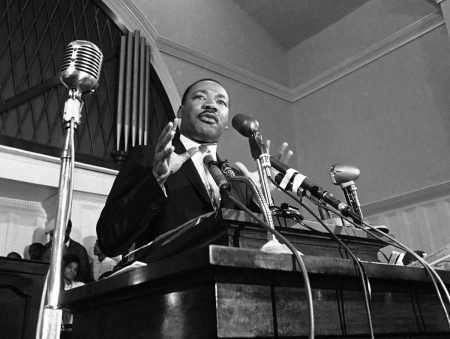 FILE - In this 1960 file photo, Martin Luther King Jr. speaks in Atlanta. The civil rights leader had carried the banner for the causes of social justice — organizing protests, leading marches and making powerful speeches exposing the scourges of segregation, poverty and racism. (AP File Photo)