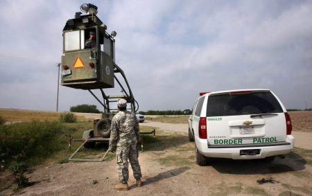 A member of the National Guard checks on his colleague inside a Border Patrol Skybox near the U.S.-Mexico border in Hidalgo, Texas, in this 2011 photo. President Trump is calling for troops on the southern border, something the past five presidents have all done on a limited basis.