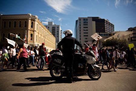 Austin Police Department set up rolling roadblocks downtown for the "Day Without Immigrants" march on Feb. 16, 2017.