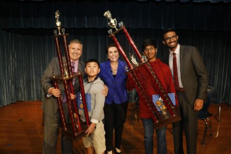 2018 Houston Public Media Spelling Bee champion Pranav Chemudupaty and runner up Benjamin Chen pose with three-time spelling champ Anjay Ajodha, and Houston Public Media's Ernie Manouse and Lisa Shumate.