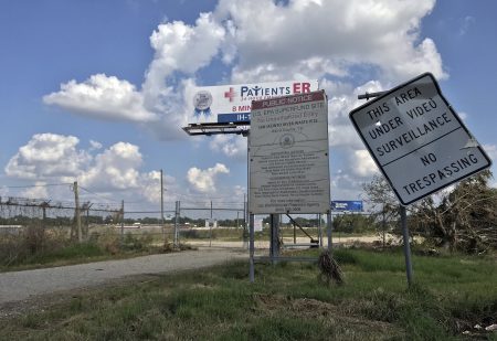 The entrance to the San Jacinto River Waste Pits site is seen, Friday, Sept. 29, 2017, in Channelview, Texas. The Environmental Protection Agency says an unknown amount of a dangerous chemical linked to birth defects and cancer may have washed downriver from a Houston-area Superfund site during the flooding from Hurricane Harvey. EPA said Thursday night it has ordered the companies responsible for the San Jacinto River Waste Pits site to immediately address damage to a protective cap of fabric and rock intended to keep sediments highly contaminated with dioxins from spreading. (AP Photo/John L. Mone)