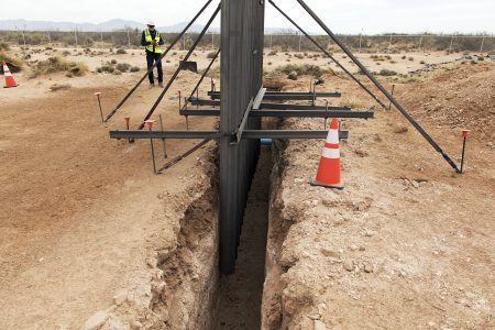 This April 6, 2018 photo provided by U.S. Customs and Border Protection shows a new type of bollard wall that will replace existing wire mesh and vehicle barriers near the Santa Teresa, N.M., port of entry. The new wall being constructed along a 20-mile (32-kilometer) stretch of the U.S.-Mexico border in southern New Mexico as part of President Donald Trump's fight against drug trafficking and illegal immigration is being advertised as a "very serious structure" made of metal and concrete. Officials gathered Monday, April 9, 2018 to mark the groundbreaking of the $73 million project at Santa Teresa. (U.S. Customs and Border Protection via AP)