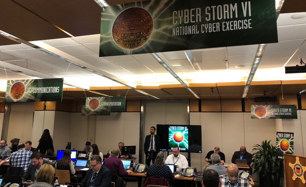 Participants in Homeland Security's cyberattack simulation work in a conference room at the Secret Service headquarters in Washington, D.C., on Tuesday.
