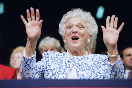 First Lady Barbara Bush reacts to Sen. Phil Gramm, who delivered the keynote address to the Republican National Convention at the Houston Astrodome, Tuesday, Aug. 18, 1992, Houston, Tex. Gramm derided Democratic candidate Bill Clinton's economic program as a "Lemon for America." (AP Photo/Marcy Nighswander)