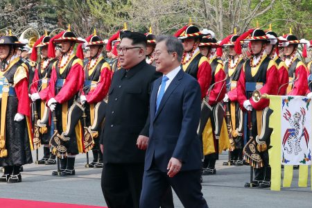 After crossing the demarcation line, Kim and Moon walk to the official welcome hall for the first North-South summit in more than a decade