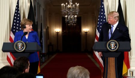 President Donald Trump speaks during a news conference with German Chancellor Angela Merkel in the East Room of the White House on Friday.