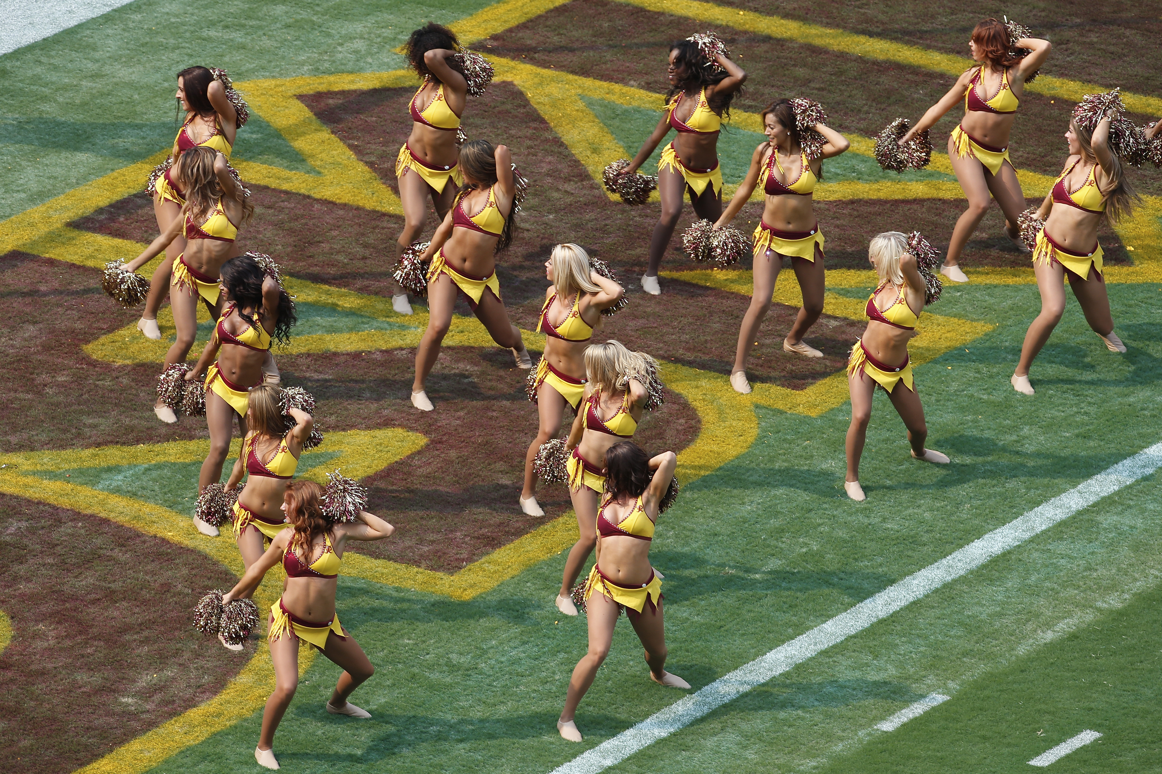 Washington's NFL Cheerleaders Say They Had To Pose Topless As VIPs Watched  – Houston Public Media