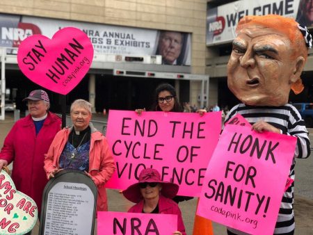 Protesters started to gather Friday afternoon outside the National Rifle Association's convention in Dallas.