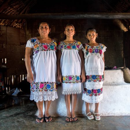 Maria de los Angeles Tun Burgos with daughters Angela, 12, and Gelmy, 9, in their family home in a Mayan village in Yucatan, Mexico.