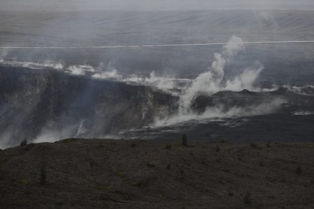 Steam and gas rise along the edge of Kilauea's summit crater in Volcanoes National Park, Hawaii, Thursday, May 10, 2018. The park is closing Friday due to the threat of an explosive volcanic eruption. (AP Photo/Jae C. Hong)